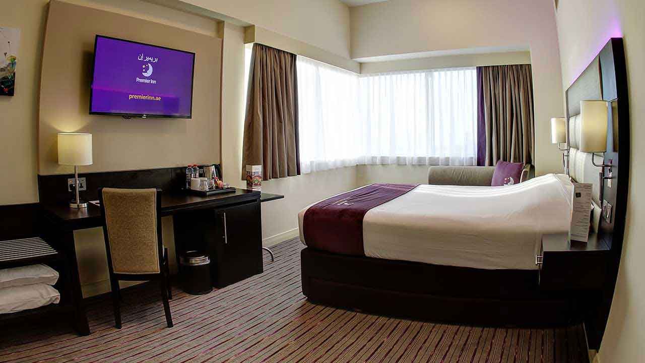 Premier Inn Dubai Ibn Battuta Mall guest room with Premier Inn welcome screen