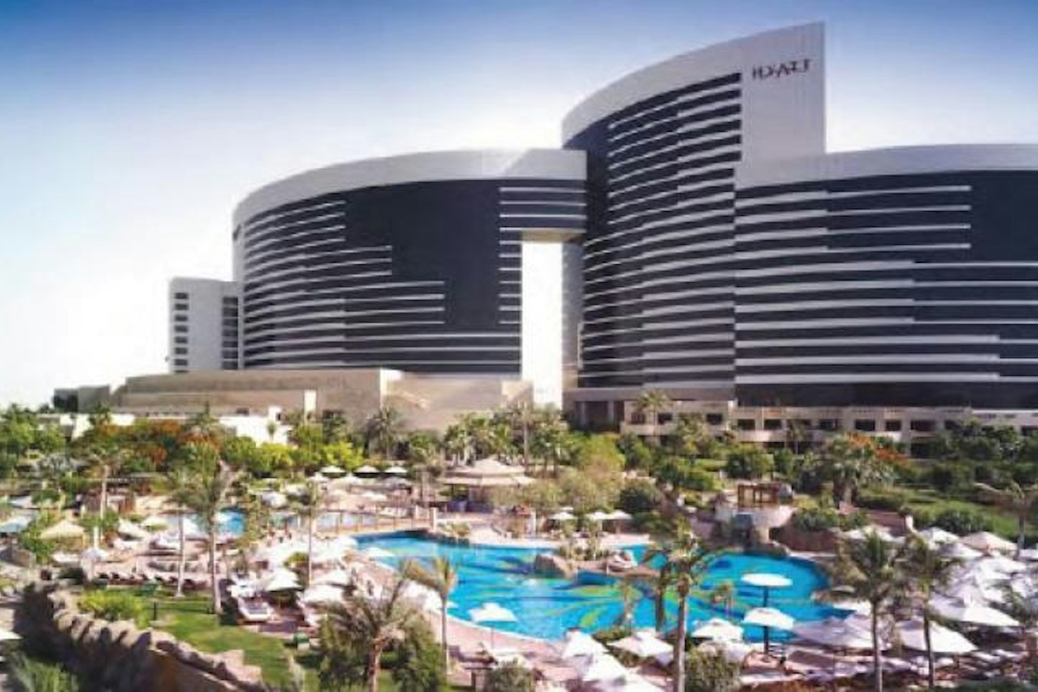 Grand Hyatt Dubai towers above landscaped pools and gardens