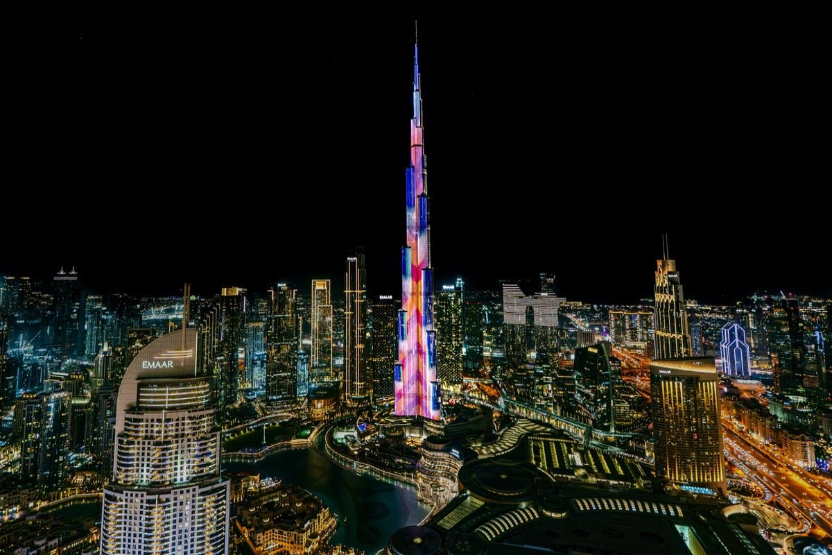 Burj Khalifa illuminated with light show over Downtown Dubai at night