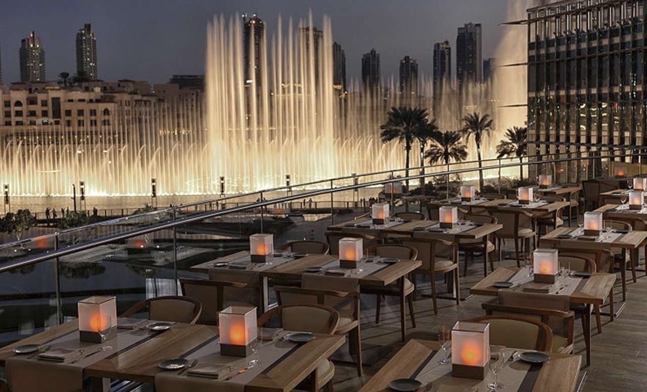 Armani Hotel Dubai terrace restaurant overlooking the Dubai Fountain at night