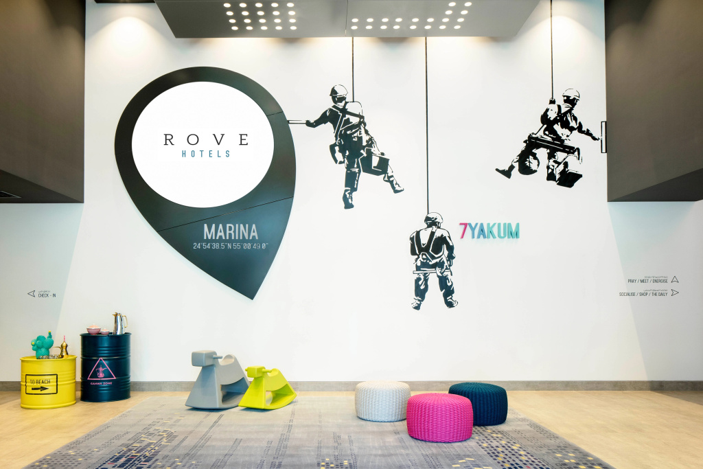 Rove Dubai Marina lobby art wall with Rove pin logo