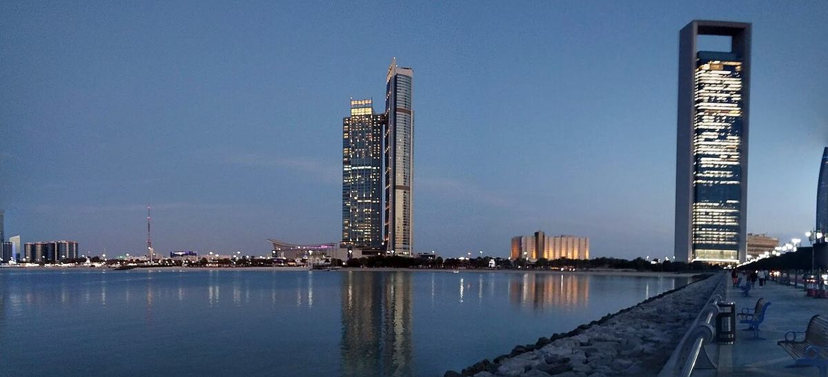 Abu Dhabi waterfront and buildings at dusk