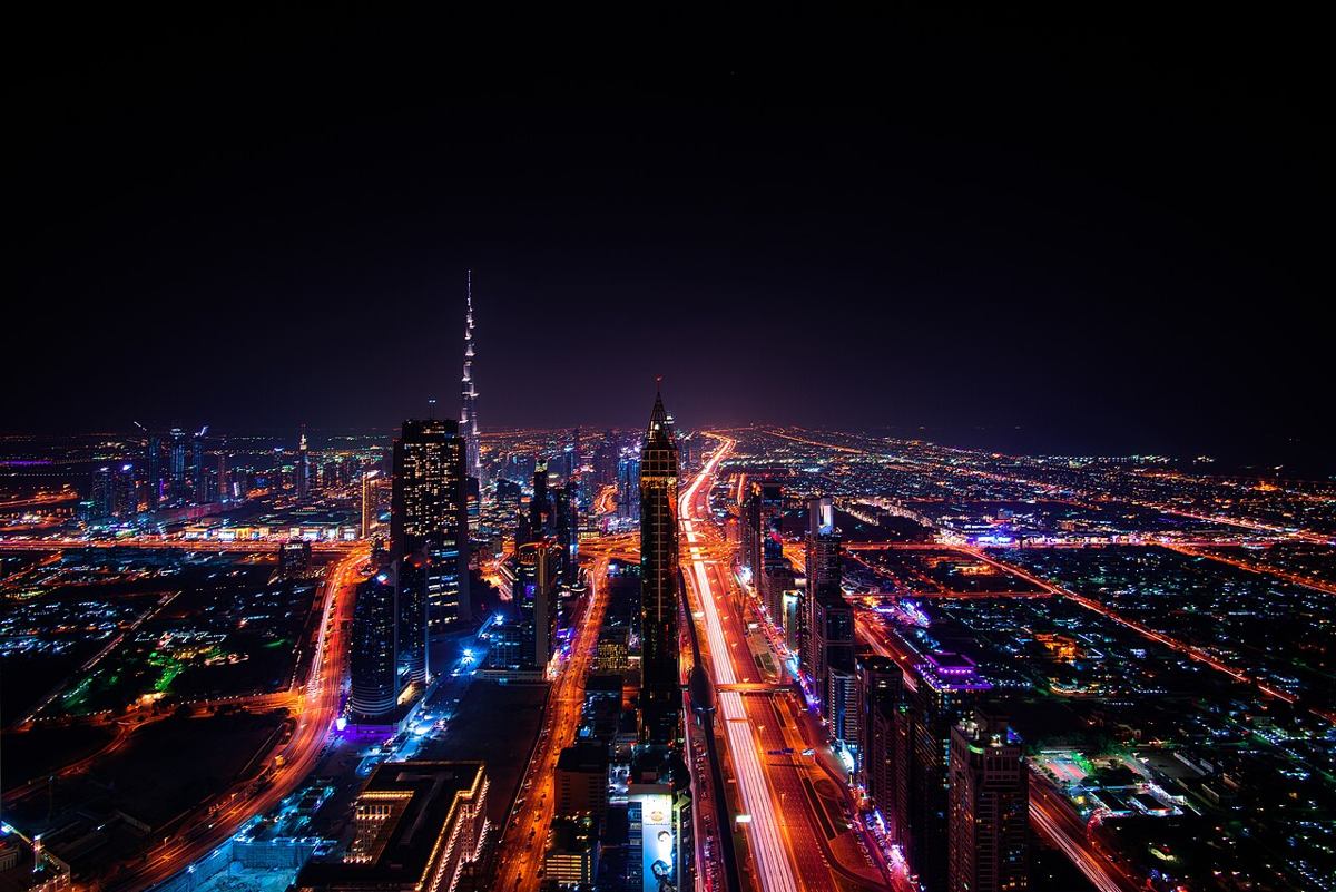 Downtown Dubai roads and towers illuminated at night
