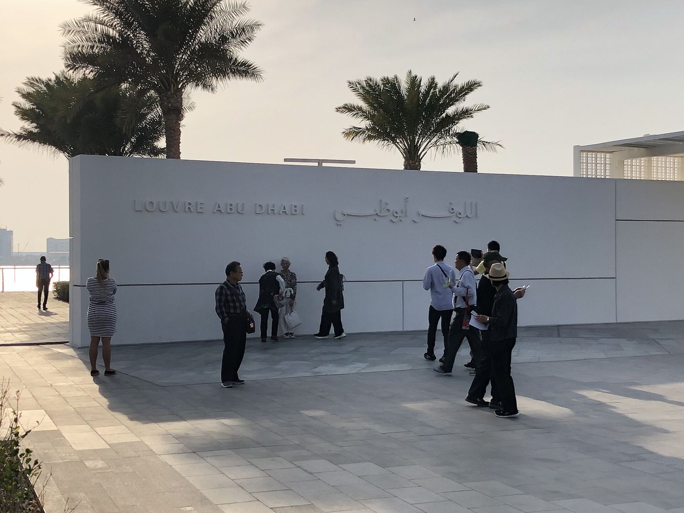 Visitors outside the Louvre Abu Dhabi building on Saadiyat Island