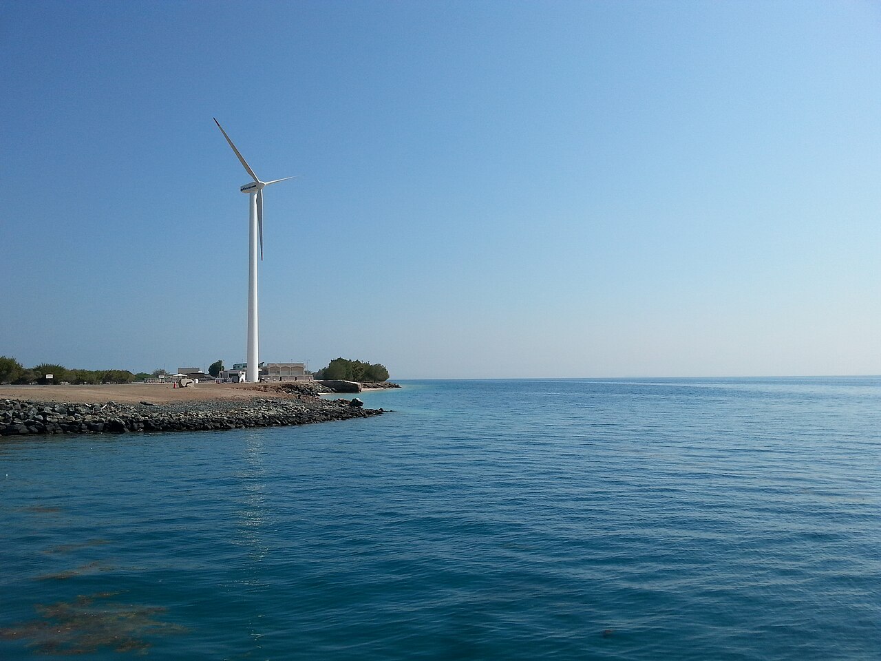 Wind turbine and coastline on Sir Bani Yas Island